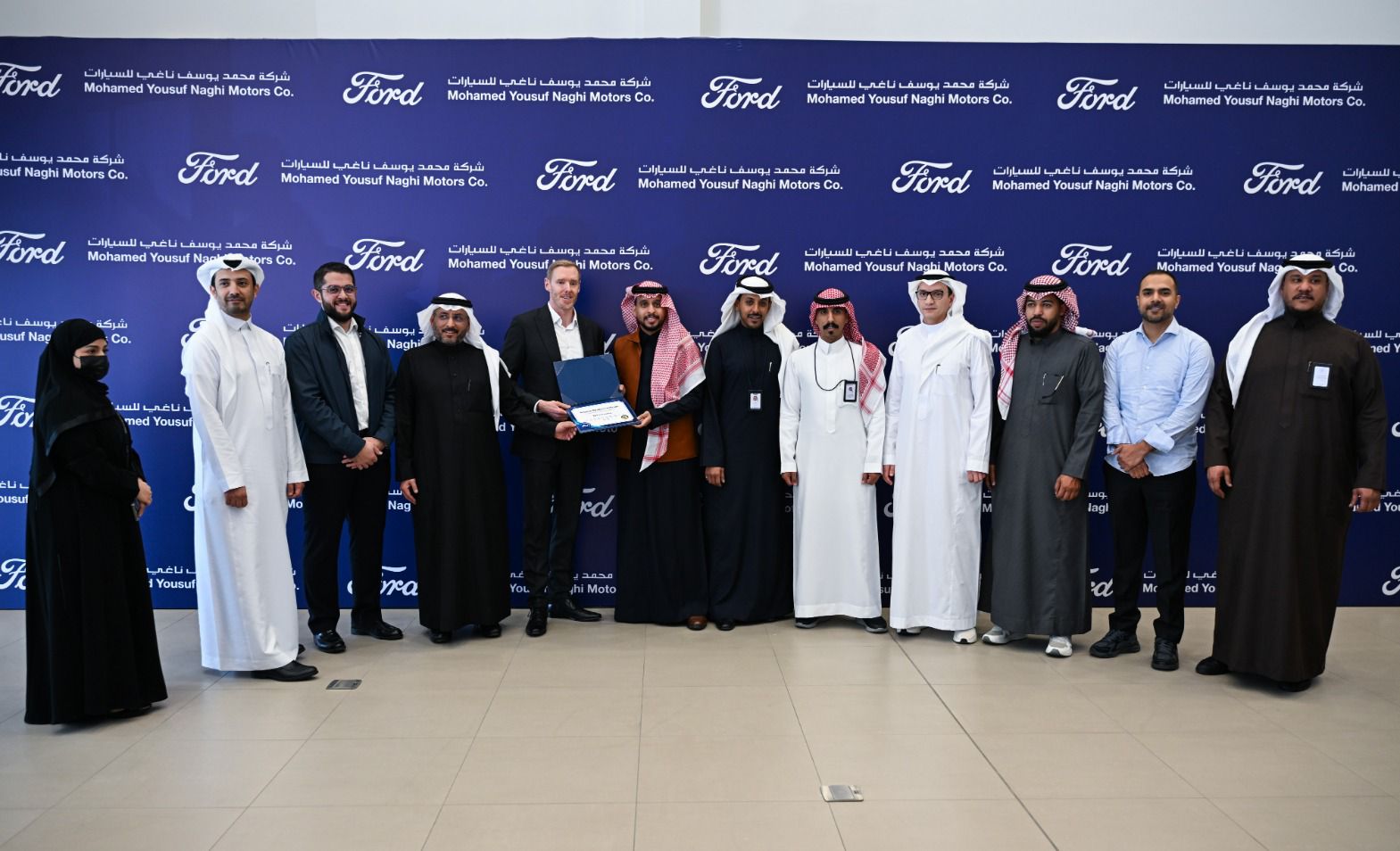 Attendees at the opening of the Ford showroom in Taif
